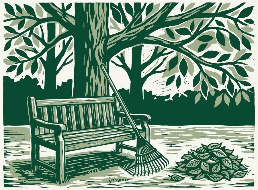 Linogravure : banc en bois sous un grand arbre en bordure d'une pelouse tondue, râteau à feuilles appuyé contre l'accoudoir